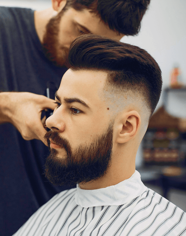 Model potongan rambut modern low fade Voolcut Barbershop